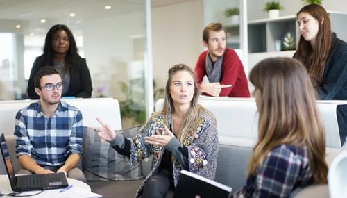 Group of young professionals having discussion.