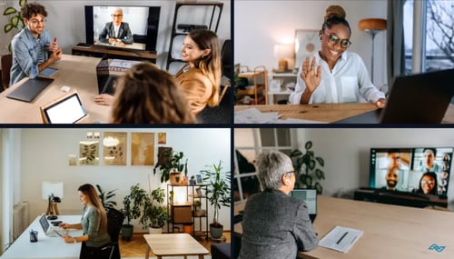 Four individuals focused on their laptops in a modern office setting, collaborating and engaged in their work.