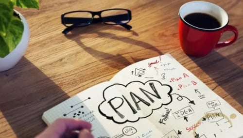 Notebook with plans and strategy on a table