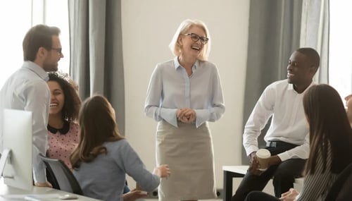 A diverse group of professionals discussing in a meeting room. 