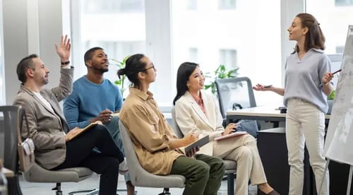 A diverse group of professionals seated in an office