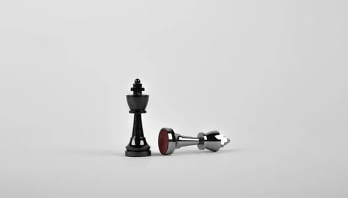 Chess pieces arranged on a chessboard, set against a vibrant background.